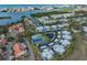 Aerial view of a condo community with pool, tennis court and boat docks, nestled on the water at 14505 Catalina Cir, Seminole, FL 33776