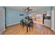 Dining area with a ceiling fan, a dining table, and a view into the kitchen at 14505 Catalina Cir, Seminole, FL 33776