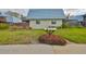 Exterior view of townhomes with well-maintained landscaping and community mailboxes at 14505 Catalina Cir, Seminole, FL 33776