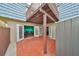 View of the patio, connecting the indoor living spaces via double doors at 14505 Catalina Cir, Seminole, FL 33776