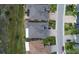 Aerial view of residences in the neighborhood showcasing roof lines and landscaping at 1545 Emerald Dunes Dr, Sun City Center, FL 33573