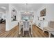 Cozy dining room with stylish chandelier, connecting seamlessly with the adjacent living space at 1545 Emerald Dunes Dr, Sun City Center, FL 33573