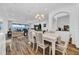 Elegant dining area flowing into the spacious living room, perfect for entertaining guests at 1545 Emerald Dunes Dr, Sun City Center, FL 33573