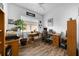 Bright home office with wood floors, ceiling fan, and a window for natural light at 1545 Emerald Dunes Dr, Sun City Center, FL 33573