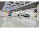 Spacious and well-lit garage with epoxy flooring and ample storage space at 18 Franklin S Ct # D, St Petersburg, FL 33711