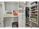 Organized walk-in closet featuring ample shelving, hanging space, drawers, and space for shoes and bags at 18 Franklin S Ct # D, St Petersburg, FL 33711