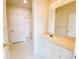 Bright bathroom with vanity, mirror, and combined tub and shower at 18001 Richmond Place Dr # 222, Tampa, FL 33647