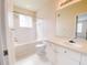 Well-lit bathroom with shower-tub, tile flooring, and vanity with sink at 18001 Richmond Place Dr # 222, Tampa, FL 33647