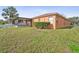 This cozy backyard has lush green grass and a covered screened patio at 2340 Lawrence Hall St, Ruskin, FL 33570