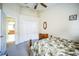 Bedroom with a large closet, neutral carpeting, and an ensuite bathroom entrance at 2340 Lawrence Hall St, Ruskin, FL 33570