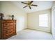 Bedroom with neutral carpet, a large window, and a classic wood-stained furniture set at 2340 Lawrence Hall St, Ruskin, FL 33570