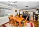 Bright living room with hardwood floors, dining table, and connecting to outdoor living space at 2492 Laurelwood Dr # E, Clearwater, FL 33763