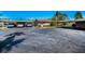 Wide shot of multiple covered parking spots in front of charming one-story homes at 2492 Laurelwood Dr # E, Clearwater, FL 33763