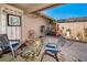 Relaxing patio area featuring stone flooring, garden decor, and comfortable seating at 2492 Laurelwood Dr # E, Clearwater, FL 33763