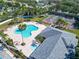 Aerial view of community pool and clubhouse with tennis and sport courts at 3902 Ixora Ct, Riverview, FL 33578