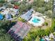 Aerial view of a community featuring a pool, clubhouse, and tennis courts at 3902 Ixora Ct, Riverview, FL 33578