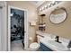 Bathroom with modern vanity and fixtures, tile flooring, and a view of the gym at 3902 Ixora Ct, Riverview, FL 33578