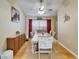 Cozy dining room with a decorative light fixture and hardwood flooring at 3902 Ixora Ct, Riverview, FL 33578