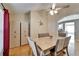 Dining area with hardwood floors, a modern table and chairs, and stylish storage cabinets at 3902 Ixora Ct, Riverview, FL 33578