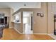 Hallway view of the kitchen with granite countertops and stainless steel appliances, and the open living space at 3902 Ixora Ct, Riverview, FL 33578