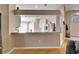 View of the kitchen featuring granite countertops, stainless steel appliances, and white cabinets at 3902 Ixora Ct, Riverview, FL 33578