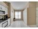 Bright kitchen with white cabinets, modern appliances, and a window for natural light at 3902 Ixora Ct, Riverview, FL 33578