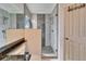 Bathroom features a modern glass walk-in shower with decorative tile and a dual shower head at 3902 Ixora Ct, Riverview, FL 33578