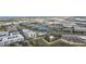 Aerial view of the building near a pond and shopping centers with ample parking at 4221 W Spruce St # 1414, Tampa, FL 33607