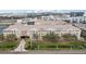 Aerial view of the condominium property with lush landscaping and plenty of parking at 4221 W Spruce St # 1414, Tampa, FL 33607