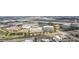 An elevated perspective of a vibrant commercial area featuring shopping centers, and airport runways at 4221 W Spruce St # 1414, Tampa, FL 33607