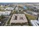 Bird's-eye view of a U-shaped complex with a central courtyard pool, manicured landscaping and parking at 4221 W Spruce St # 1414, Tampa, FL 33607