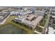 Aerial view of community with parking, green space and pond in urban setting at 4221 W Spruce St # 1414, Tampa, FL 33607