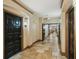 Neutral hallway showcasing tile floors leading to doors in a multi-Gathering building at 4221 W Spruce St # 1414, Tampa, FL 33607