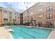 Outdoor pool with sunbathing area, perfect for community enjoyment at 4221 W Spruce St # 1414, Tampa, FL 33607