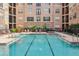 Community swimming pool with lounge chairs for sunny relaxation at 4221 W Spruce St # 1414, Tampa, FL 33607