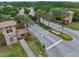 Community entrance with stone gatehouses, lush landscaping, and clearly marked lanes at 4303 Ortona Ln, Wesley Chapel, FL 33543