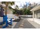 Backyard with a pool, white fence, pool table, stepping stones and gray gravel at 4310 W San Luis St, Tampa, FL 33629