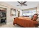 Relaxing bedroom showcasing a spacious closet and dresser next to the bed and window at 4310 W San Luis St, Tampa, FL 33629