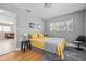 Comfortable bedroom with hardwood floors and a grey accent wall at 4310 W San Luis St, Tampa, FL 33629