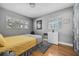 Well-lit bedroom featuring natural hardwood flooring, a dresser, and bright windows at 4310 W San Luis St, Tampa, FL 33629