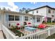 Charming front yard with a white picket fence, sitting area, and blue accents at 4310 W San Luis St, Tampa, FL 33629