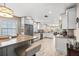 Modern kitchen featuring stainless steel appliances, white cabinetry, and a breakfast bar open to the living area at 4310 W San Luis St, Tampa, FL 33629