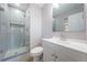 Updated bathroom featuring modern shower with glass door and gray subway tile at 4807 Wynwood Dr, Tampa, FL 33615