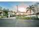 Waterfront community boat ramp with parking area and serene sunset view overlooking calm water at 4807 Wynwood Dr, Tampa, FL 33615