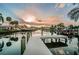 Beautiful waterfront view featuring a private dock, serene water reflections, and stunning sunset ambiance at 4807 Wynwood Dr, Tampa, FL 33615