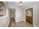 Inviting foyer with a decorative front door, neutral walls, and stylish flooring, creating a warm entry at 4807 Wynwood Dr, Tampa, FL 33615