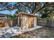 Backyard shed with double doors for easy access and storage at 4807 Wynwood Dr, Tampa, FL 33615