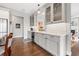 Butler's pantry features elegant gray cabinetry, glass display shelves, and ample counter space at 58 Inness Dr, Tarpon Springs, FL 34689