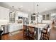 Bright kitchen with stainless steel appliances, white cabinets, and a large island with seating at 58 Inness Dr, Tarpon Springs, FL 34689