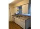 Close-up showcasing the kitchen with neutral countertops and white cabinets at 5924 Brickleberry Ln # 101, Zephyrhills, FL 33541